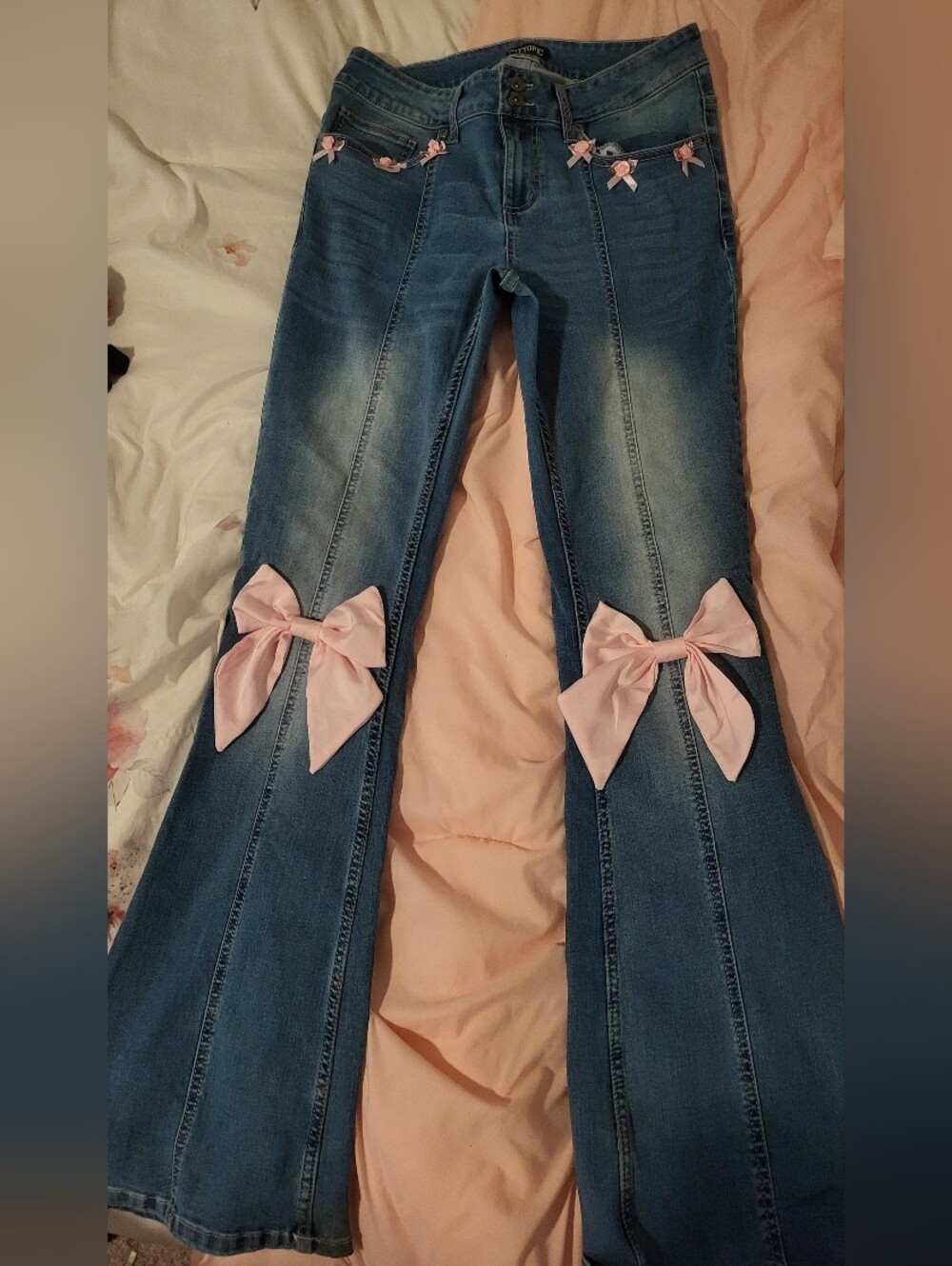 Women’s Blue Denim Flares with Pink Bow Accents